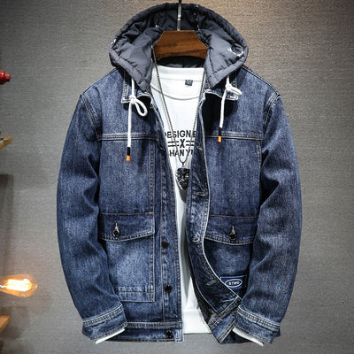 a blue jean jacket hanging on a wall
