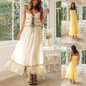 Woman wearing a Spaghetti Strap Long Dresses With Bow Pleat Design